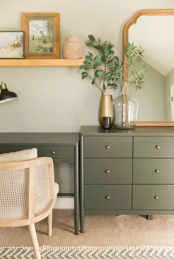 a pretty olive green dresser and a matching desk with gold knobs beautifully blend with a farmhouse space and add a delicate touch of color
