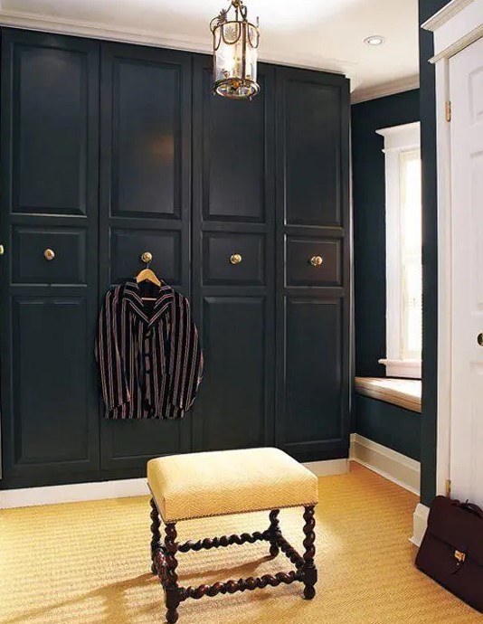 very elegant Pax hack with black paint, molding and vintage brass knobs is ideal for vintage spaces