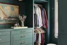 50 a cool and elegant walk-in closet with IKEA Pax units hacked, done in a lovely green shade, with drawers, baskets, some decor and a pouf