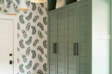 52 a farmhouse renovation of an IKEA Pax wardrobe, done in a soft green shade, with shiplap doors, black handles and baskets