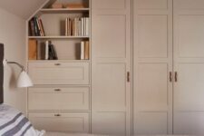 53 a lovely blush bedroom with matching blush IKEA Pax wardrobes, open shelves and drawers, a bed with blush bedding