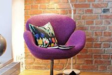 a bold reading nook with a purple Swan chair and a colorful pillow, a white floor lamp and a bold rug is a cool idea