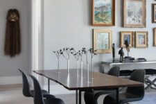 a lovely dining space with a gallery wall