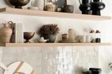 02 a beautiful neutral kitchen with neutral zellige tiles, light-stained shelves and cabinets is a chic and catchy idea
