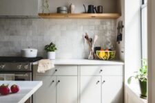 08 a grey Scandinavian kitchen with open shelves, white countertops, a neutral Zellige tile backsplash and potted plants
