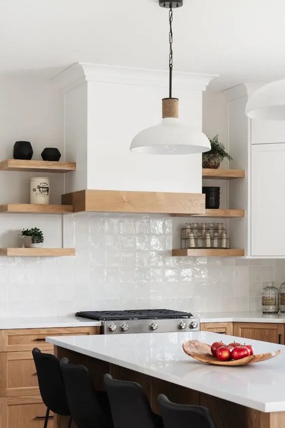 a modern farmhouse kitchen with stained cabinets, a white zellige tile backsplash and open shelves is cool