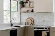 17 a refined modern kitchen with sleek grey cabinets, a Zellige tile backsplash, a hood and open shelves, black fixtures