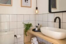a contemporary powder room with square tiles
