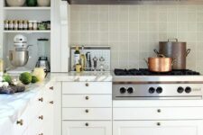 52 a white farmhouse kitchen with white stone countertops and a grey square tile backsplash and open shelves