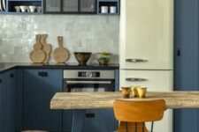 a stylish kitchen with a rough wood dining table
