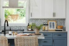 a cozy kitchen with a hex tile backsplash
