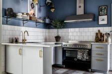 a bold kitchen with blue walls, white lower cabinets, a white square tile backsplash, an open shelf and some art