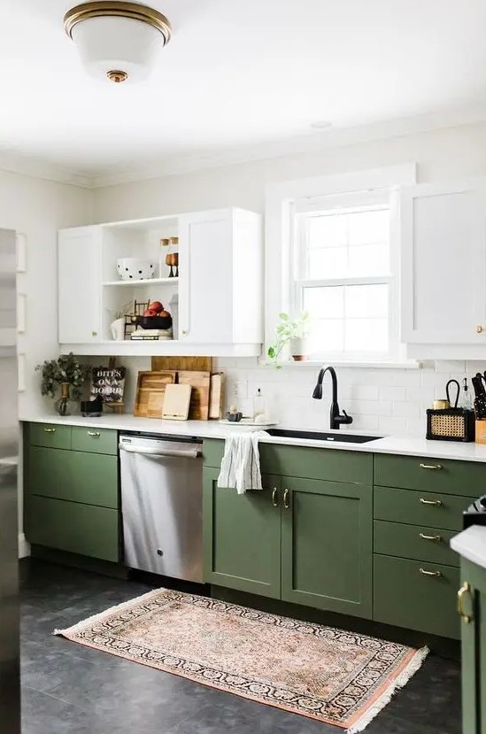 a chic contemporary kitchen with olive green and white cabinets, gold handles and white countertops plus a boho rug