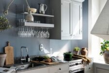a Nordic kitchen design with a blue accent wall
