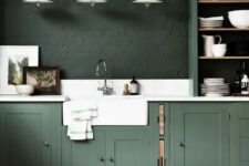 a moody kitchen design in different shades of green