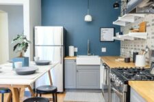 a lovely IKEA kitchen with a blue accent wall