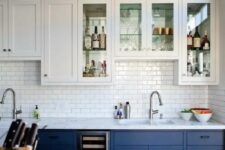 bold blue and white cabinets plus a white subway tile backsplash for a cool look with a touch of retro