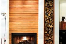 04 a built-in fireplace and a niche for firewood next to it add warmth and coziness to the space