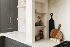 06 a modern farmhouse kitchen with graphite grey cabinets, built-in ones, a niche with small shelves that are used fro storage and display