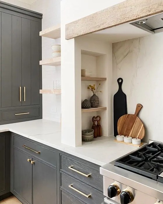 a modern farmhouse kitchen with graphite grey cabinets, built-in ones, a niche with small shelves that are used fro storage and display