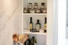 15 niche shelves next to the cooker, with oils, porcelain and spices are a very functional and practical solution for any kitchen