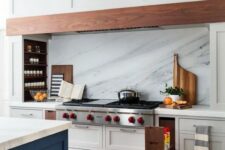16 niche shelves with condiments and spices next to the cooker are a cool idea for a modern kitchen, they look very nice