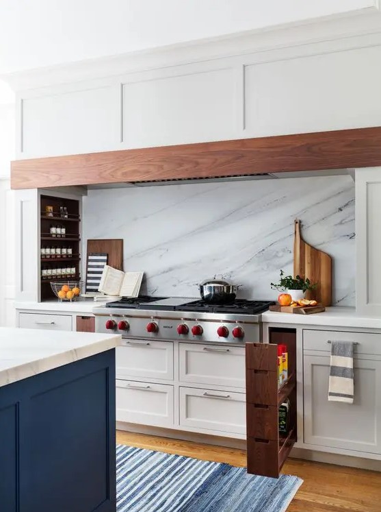 niche shelves with condiments and spices next to the cooker are a cool idea for a modern kitchen, they look very nice