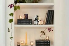 21 a lovely arched niche with shelves displaying books, candles and a potted plant is a stylish idea for a any space