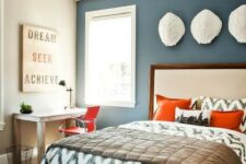 28 a guest bed and a home office are tied with the use of orange, which makes the space cool
