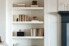 41 a niche with a series of shelves is a stylish idea for any space, here it’s used to display books and vases of various kinds