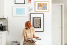 a bright and fun gallery wall with mismatching frames, shapes, sizes and artworks for a fun and eclectic touch