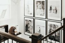 a chic black and white grid gallery wall with matching black frames and white matting adds style and a modern feel to the space