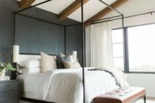 a lovely bedroom with wooden beams