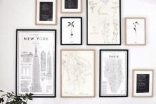 a chic monochromatic gallery wall with black and blonde wood frames, black and white artworks and prints