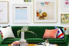 a colorful living room with a green sofa, a stained coffee table, a printed rug, a free form gallery wall