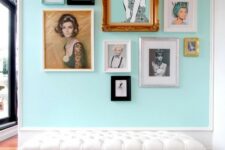 a glam free form gallery wall built around the central piece of art, with turquoise matting and mostly black and white or muted color art