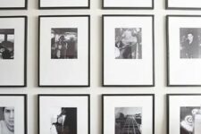 a grid black and white gallery wall made eye-catchy with asymmetrical matting and thin black frames