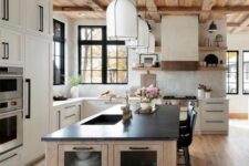a luxurious modern farmhouse kitchen with creamy cabinets, a stained kitchen island, black stools, open shelves