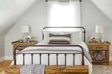 a modern farmhouse bedroom with a wooden ceiling, a wrought bed, wooden nightstands and a hairpin leg bench, some printed textiles