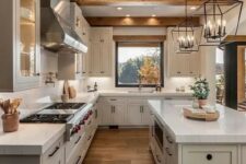 a modern farmhouse dove grey kitchen with stone countertops, wooden beams on the ceiling and catchy pendant lamps