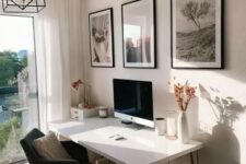 a serene Scandinavian working space with a hairpin leg desk, a black chair, a mini gallery wall and a black pendant lamp