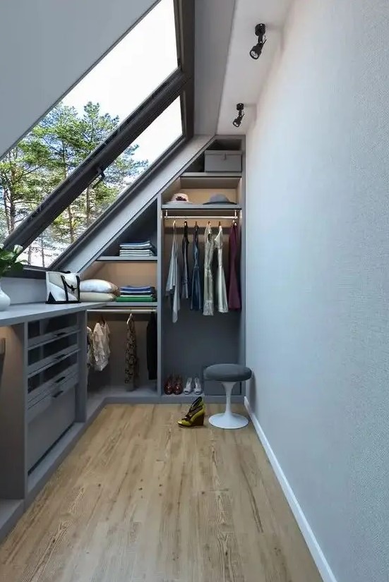 a small and narrow closet with built-in open storage units, shelves and drawers is a smart solution for a small home