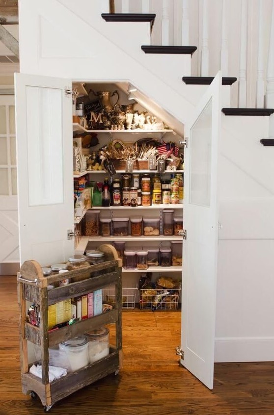 a staircase pantry built in, with many shelves and additional lights will save you a lot of space