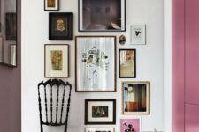 a stylish descending free form gallery wall starting with a long and narrow piece and going to the floor, with mismatching frames