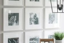 a stylish gallery wall with black and white photos in matching white frames is a preppy idea with chic