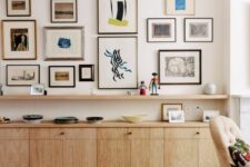a stylish mid-century modern space with a stained storage unit and a shelf, an eclectic free form gallery wall and a bold boho rug