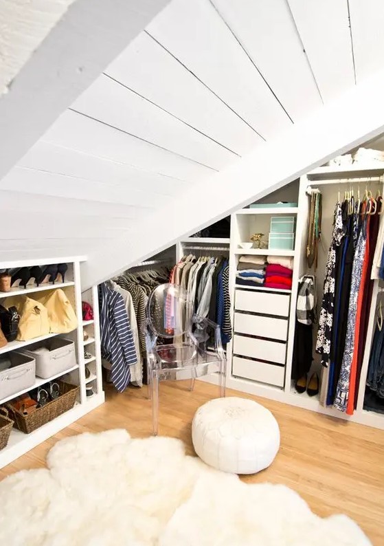 an attic closet with open storage compartments, drawers and built-ins is a very cool and smart idea for a home with an attic space
