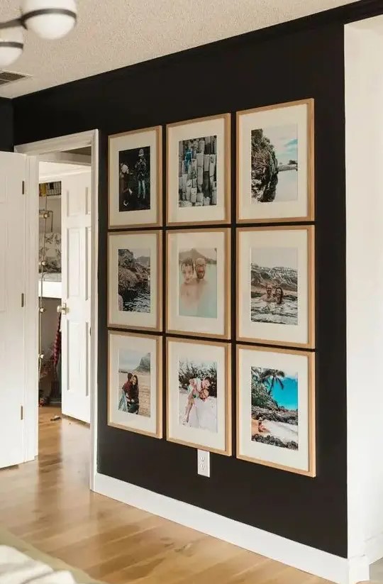 an inspiring symmetrical gallery wall with colorful photos from vacations in matching wood frames will raise your best memories