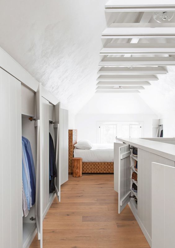 lovely built-in attic wardrobes plus a large storage unit that looks like a kitchen island but in reality is a dresser