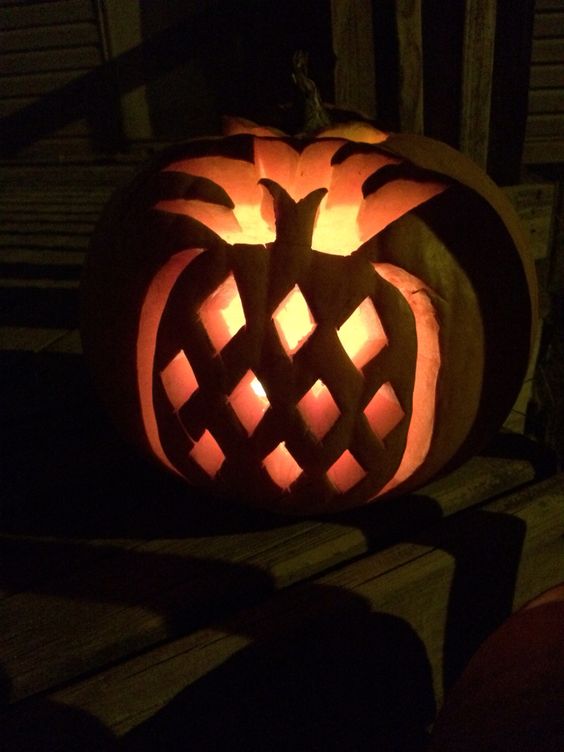 a Halloween jack-o-lantern with a carved pineapple is a cool decoration for outdoors and indoors